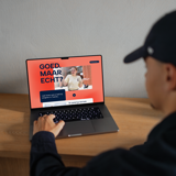 A person wearing a black cap looks at the "Good. But Real!" campaign questionnaire on a laptop 