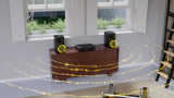ARCAM Radia speaker on furniture with sound waves