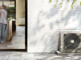 Heat pump unit LG Climate next to house