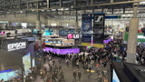 ISE hall with technology presentations and audience on the move