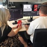 Timo and Kelly behind desk