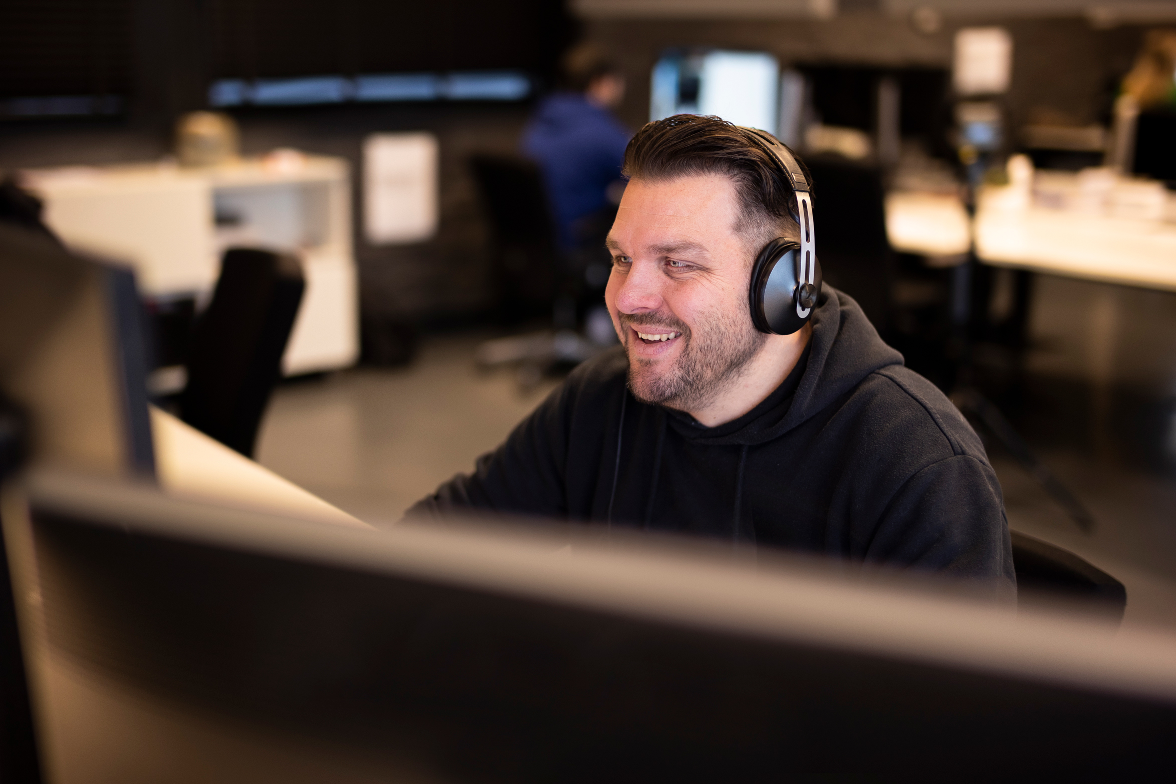 Dennis at work with headphones