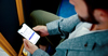 Man on His Cell Phone on the Bus